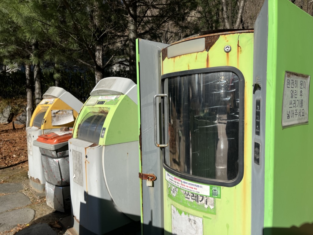 A row of green and white Auto Clean machines